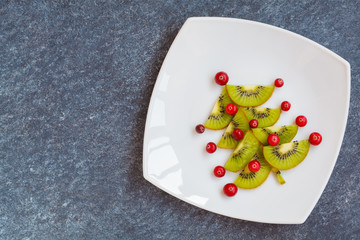 Decorating christmas table, New Year's spruce from kiwi.