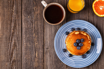 Delicious breakfast on a rustic table.