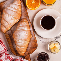 Delicious breakfast with fresh croissants.