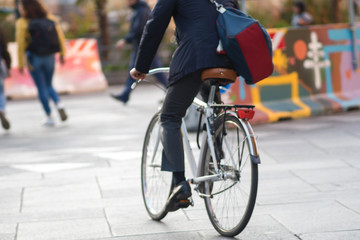 Fototapeta na wymiar A man on a Bicycle, urban eco-friendly transport