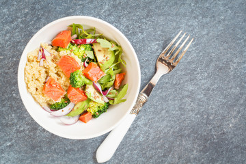 Healthy salad with broccoli, fish and quinoa