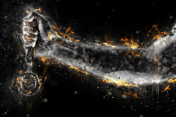 Man's hand in a fire is holding gold medal. Winner in a competition.