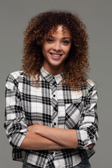 Portrait of an attractive young woman in a plaid shirt