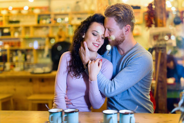 Romantic couple having date in coffee shop