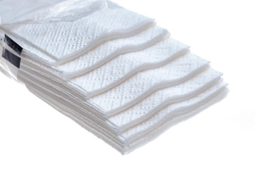 Folded white napkin isolated