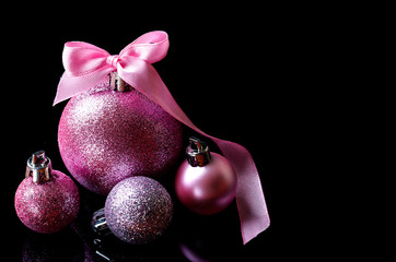 Christmas balls isolated on black background, free space.