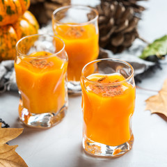 Thanksgiving autumn alcohol drink cocktail beverage with pumpkins and leaves