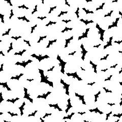 Monochrome seamless pattern with soaring bats on a white background for decoration on Halloween
