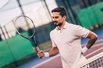 Man on tennis court