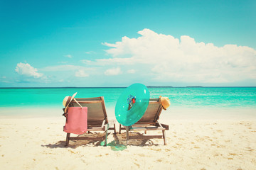 Two beach chairs on tropical vacation