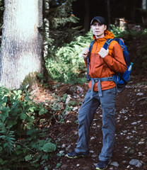 Photo of man in sports clothes and with backpack