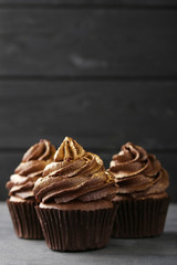 Chocolate cupcakes on grey wooden table