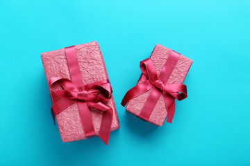 Gift boxes with ribbon on blue background