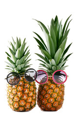 Fototapeta premium Ripe pineapple with sunglasses isolated on a white background