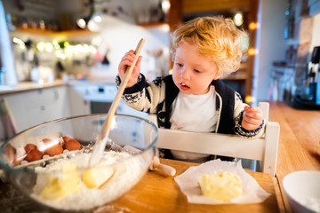 Young family making cookies at home.