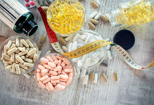 Nutritional supplements in capsules and tablets. Selective focus, shallow DOF