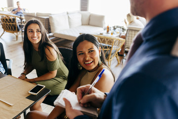People ordering in cafe