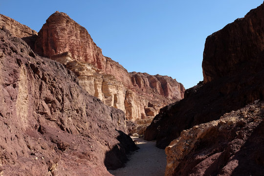 Scenic trail in red sandstone canyon of Eilat Mountains.