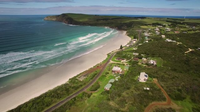 Forward flight toward Cape Bridgewater white sandy ocean beach. Victoria, Australia