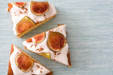 Delicious fig cake on blue background.Top view
