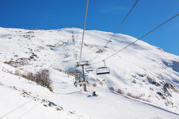 Fototapeta na wymiar Winter panorama of the mountain with ski slopes. Caucasus. Landscape high peaks in clear weather.
