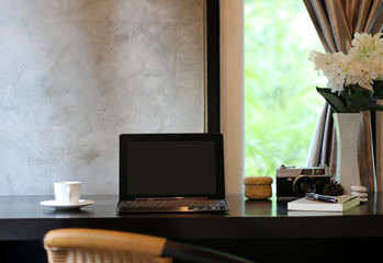 Laptop On the desk In office at home style loft cement wall in background