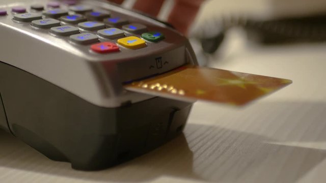 Pay for purchases, insert a bank card into the terminal. 3840x2160, 4K