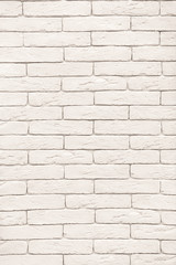 vertical photo of white brick wall, exterior and interior decoration