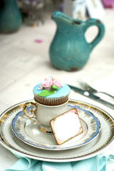 Wedding cupcake in a cup with a blank place card