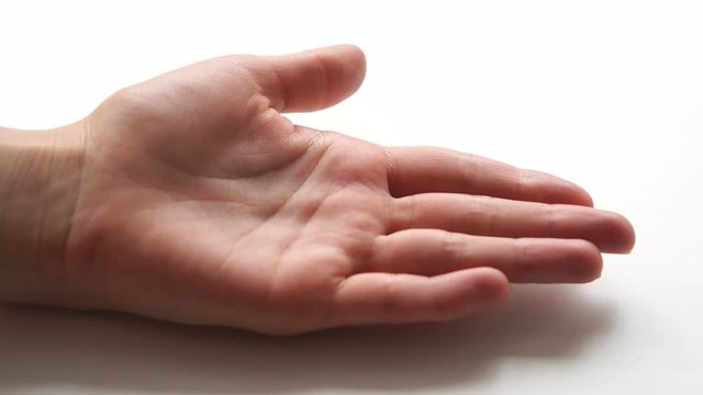 The hand requering the money from the debtor. Pile of one hundred dollar bills