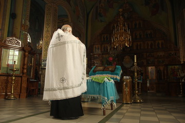 The priest reads a prayer