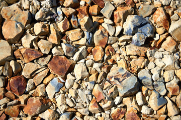 The background of many yellow, black and white stones