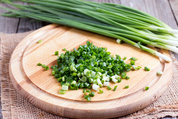 Fresh green onions on a cutting board