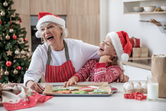 Joyful granny celebrating winter holidays with her grandchild