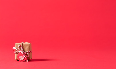 Small present box on a red background