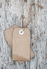 Blank tag retro style on old wood texture