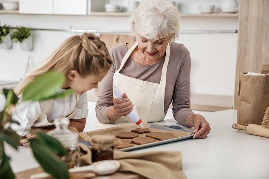 Friendly family preparing sweet pastry for special occasion
