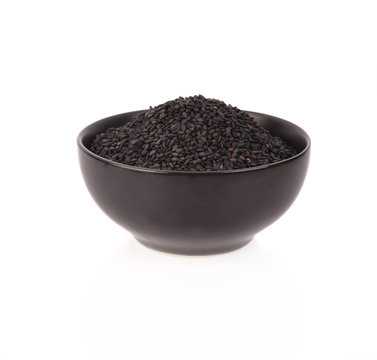 Black Sesame Seeds in  bowl on white background