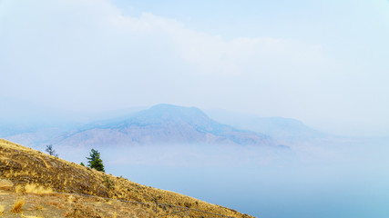 Smoke hanging over Kamloops Lake in central British Columbia because of the many forest fires in the summer of 2017