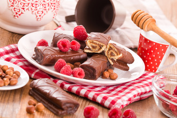 Chocolate rolls with hazelnuts and raspberries.