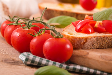 Bruschetta bread with basil and chopped tomatoes. 