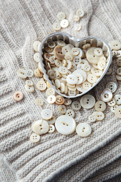 Heart shaped container with pearl buttons
