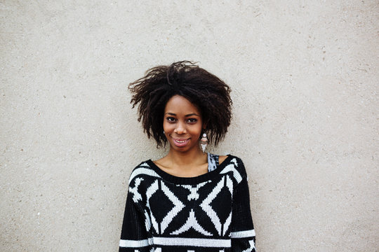 Facial expression of a young african woman: smiling