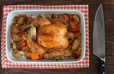 Baked chicken with vegetables. horizontal view from above