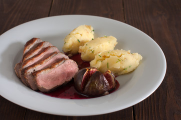 duck breast with sauce and honey fig
