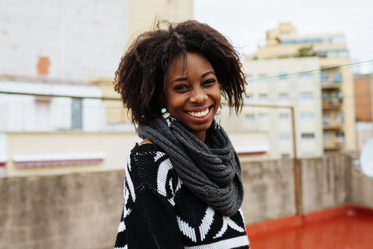 Young happy black woman smiling at the camera