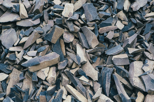 Pile of fractured and worn basalt rocks