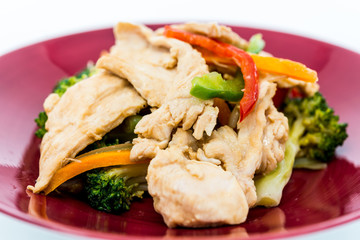 wok fried chicken stir fry with sweet peppers and chinese vegetables