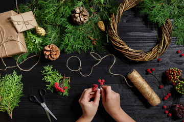 Manufacturer of Christmas decor with their own hands. Christmas wreath for the holiday. The new...