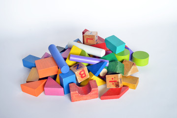 wooden constructions for children play  wooden colored blocks, construction game,   part of a series, closeup